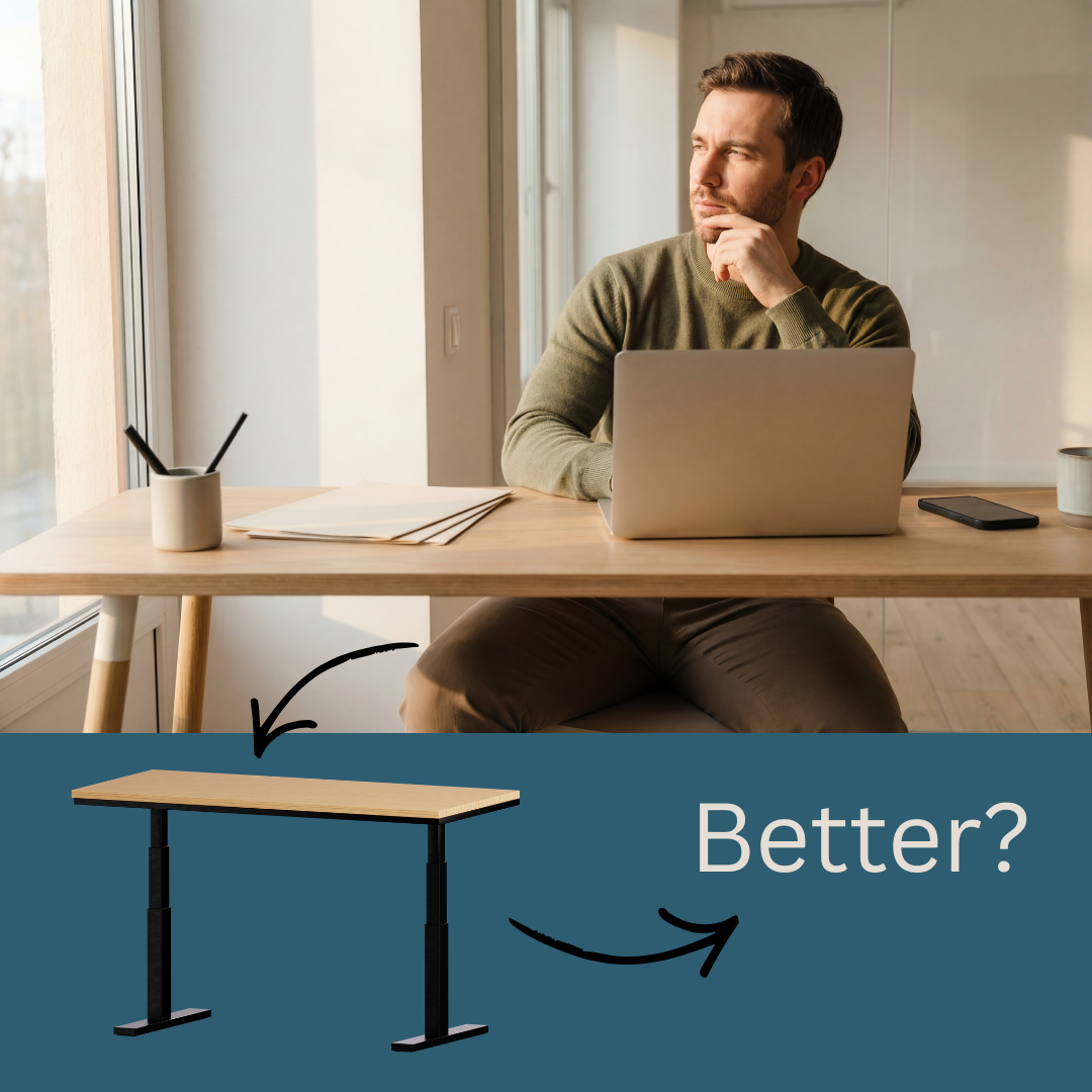 man sat at his desk wondering if he would be better with a standing desk.